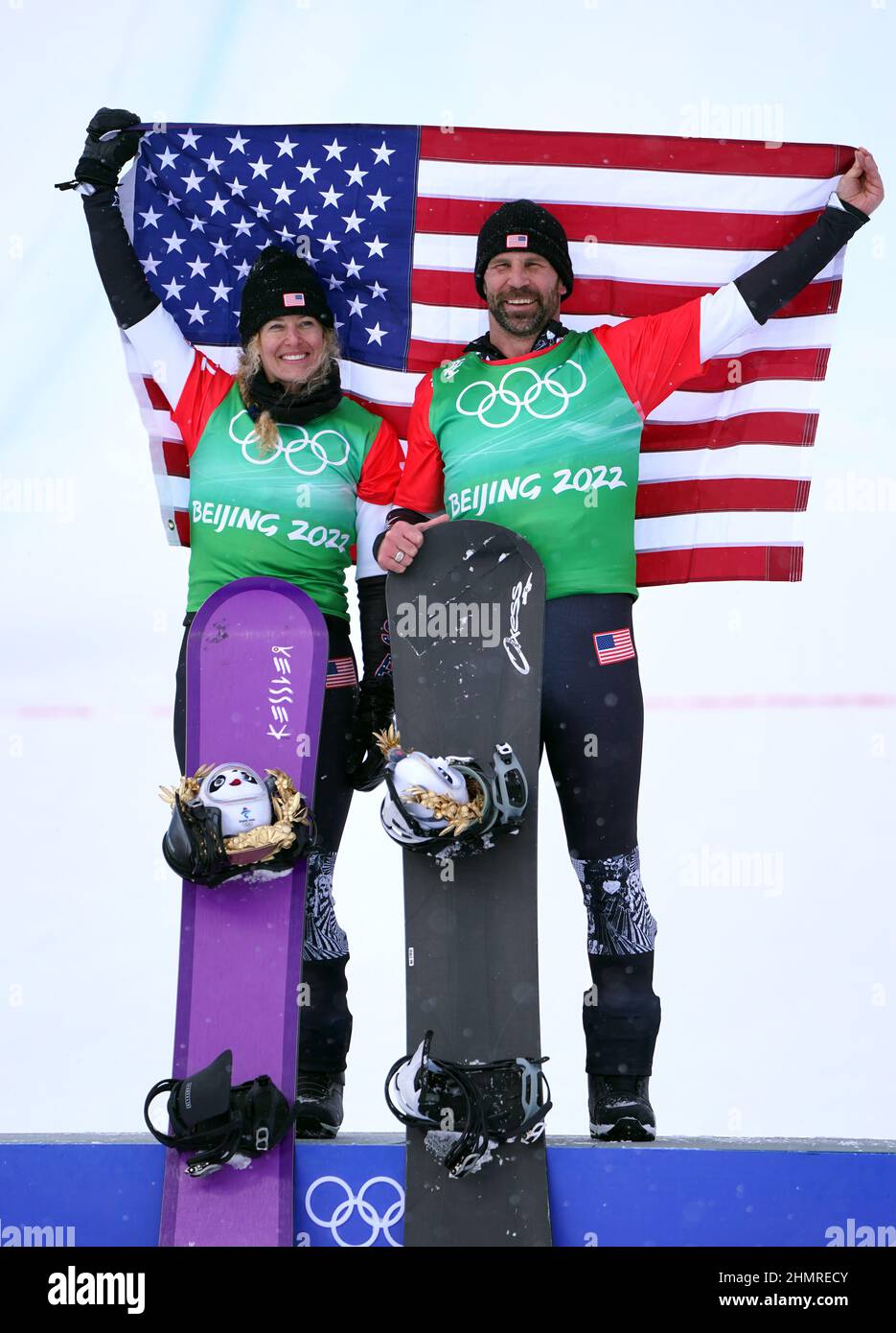 USA's Lindsey Jacobellis (left) and Nick Baumgartner celebrate gold in
