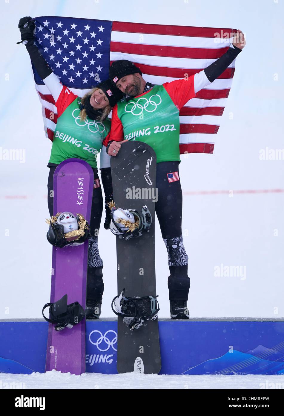 USA's Lindsey Jacobellis (left) and Nick Baumgartner celebrate gold in