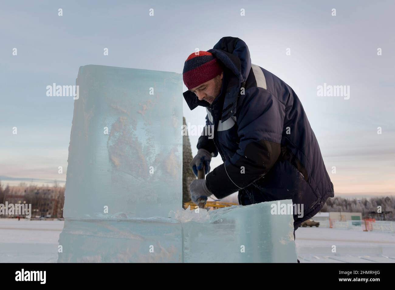 Worker with a chisel in his hand at a construction site Stock Photo - Alamy