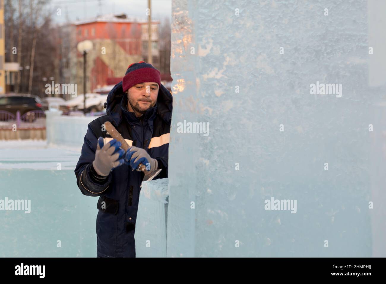 Worker with a chisel in his hand at a construction site Stock Photo - Alamy