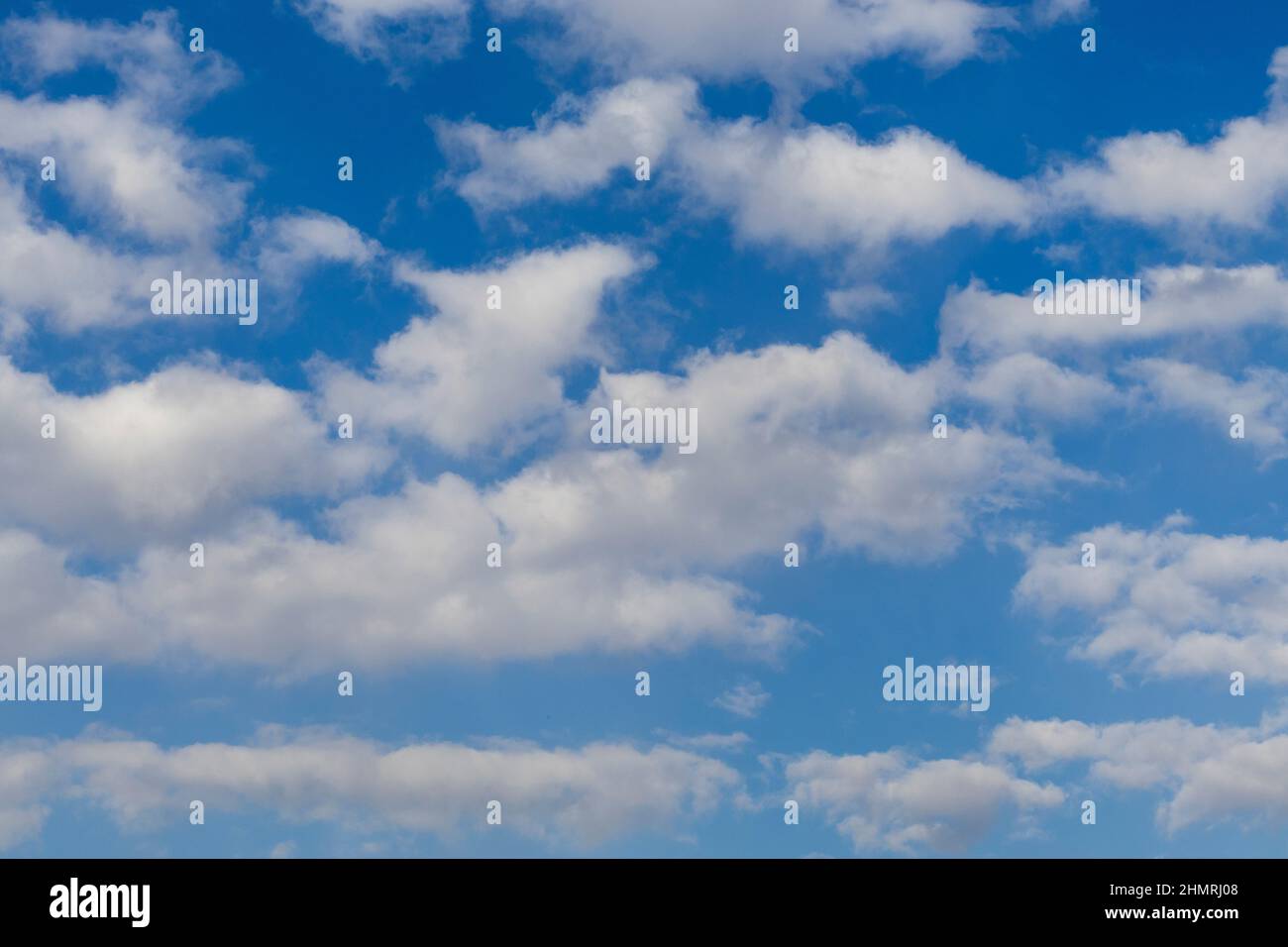 Puffy white clouds with blue sky Stock Photo Alamy