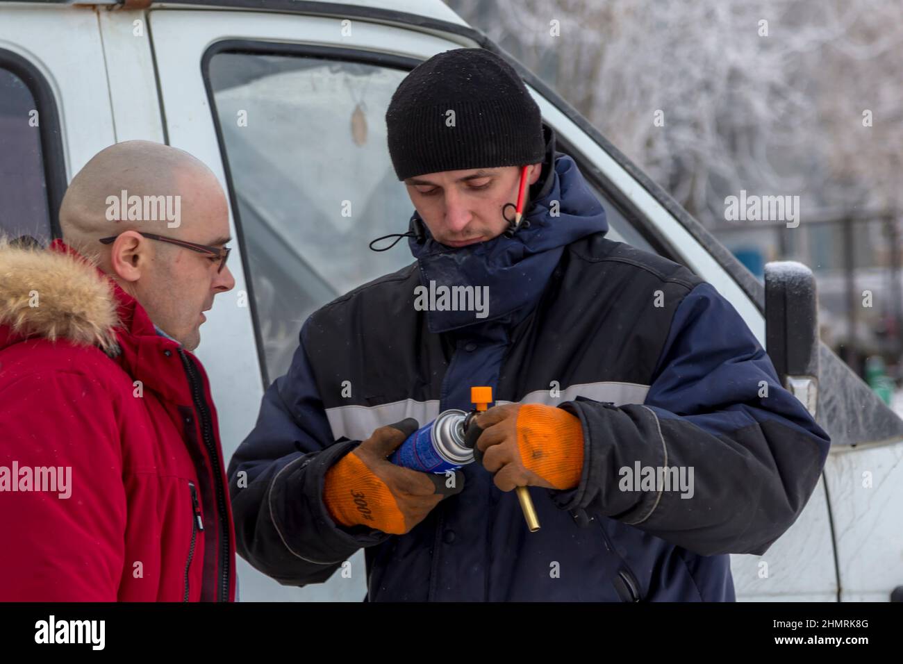 Installers setting up a gas burner at a construction site Stock Photo Alamy