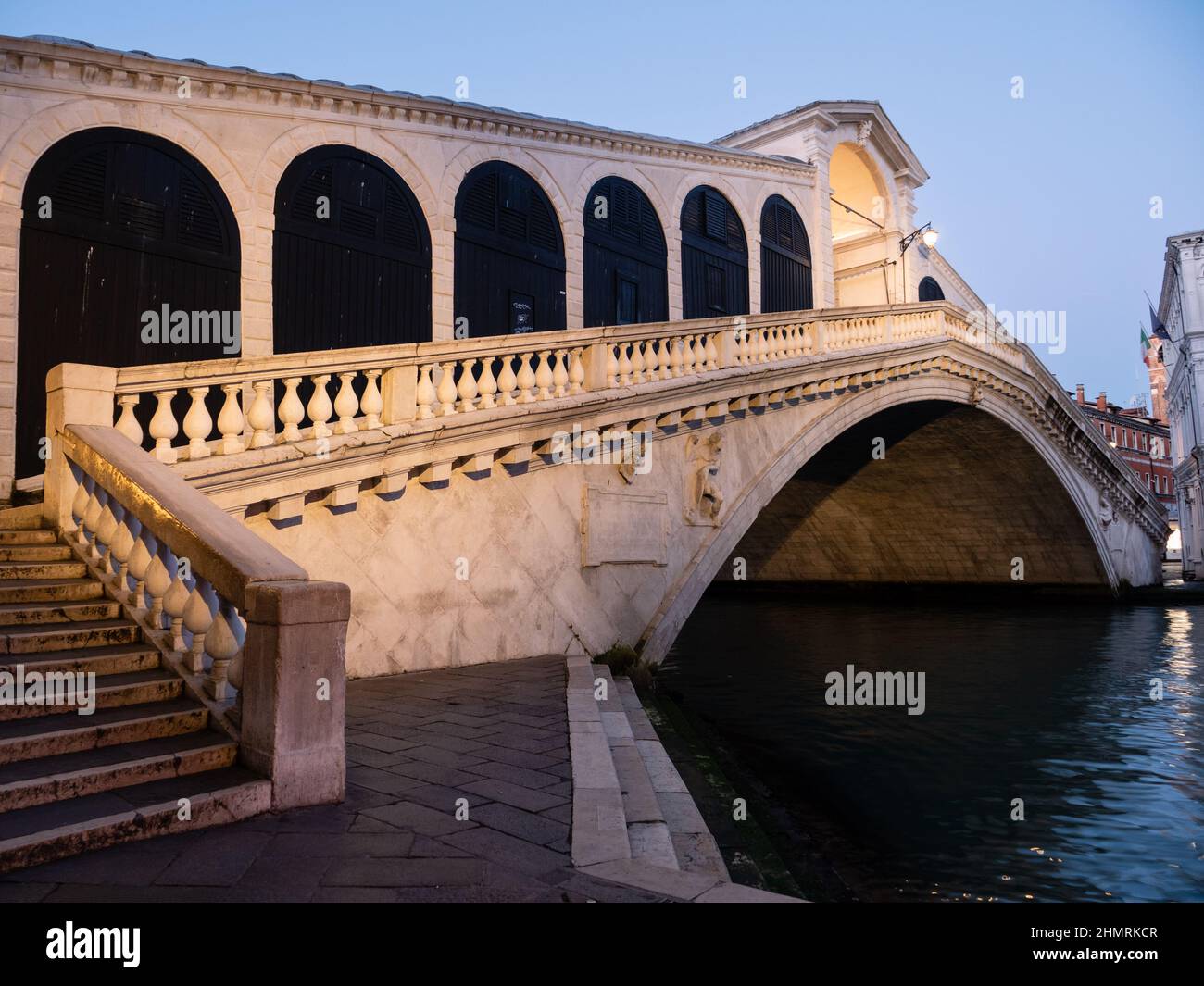 Rialto Bridge or Ponte di Rialto in Venice, Italy, Illuminated and Lonely in the Blue Hour of the Early Morning Stock Photo