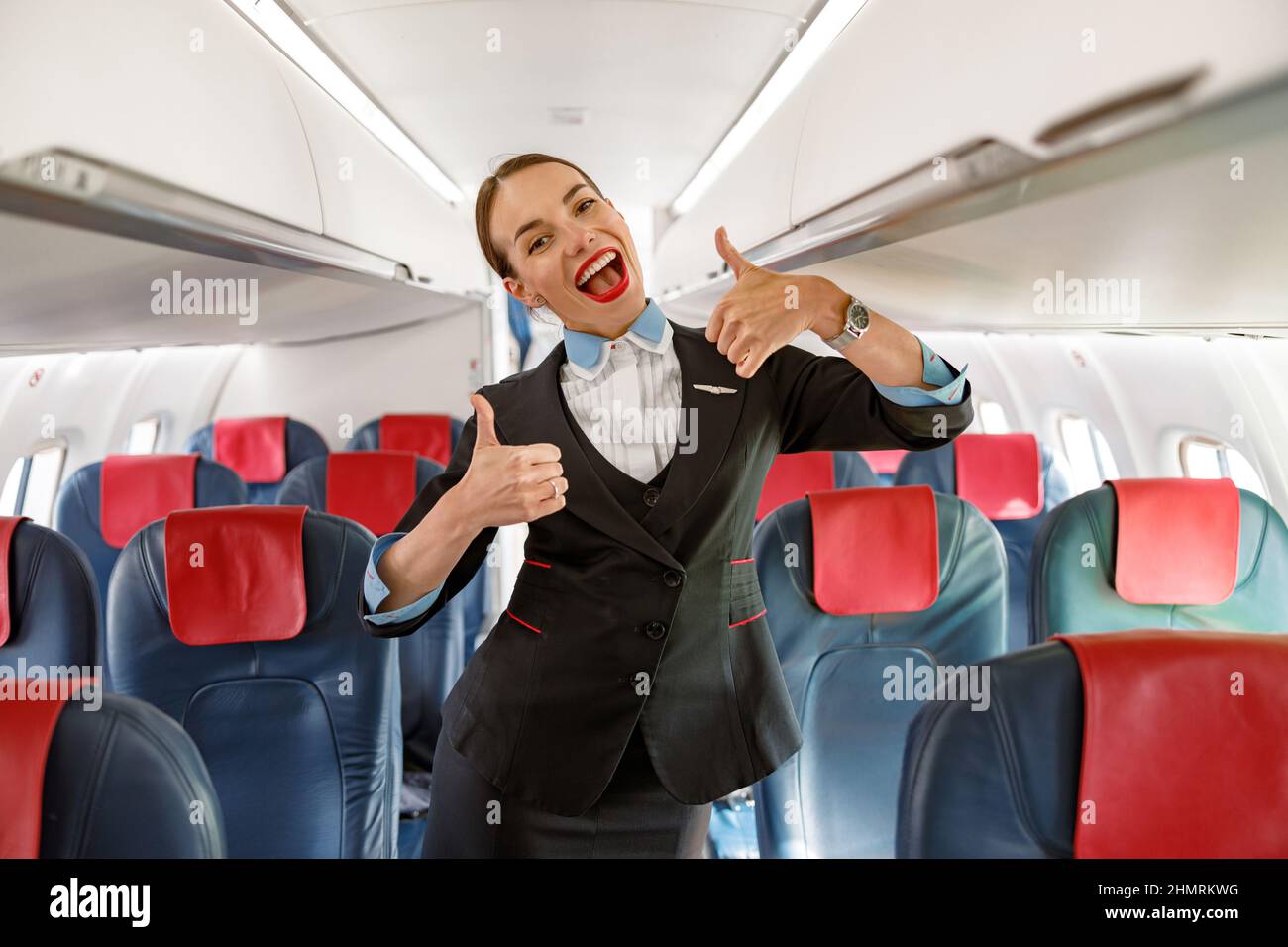 Happy flight attendant thumbs up hires stock photography and images