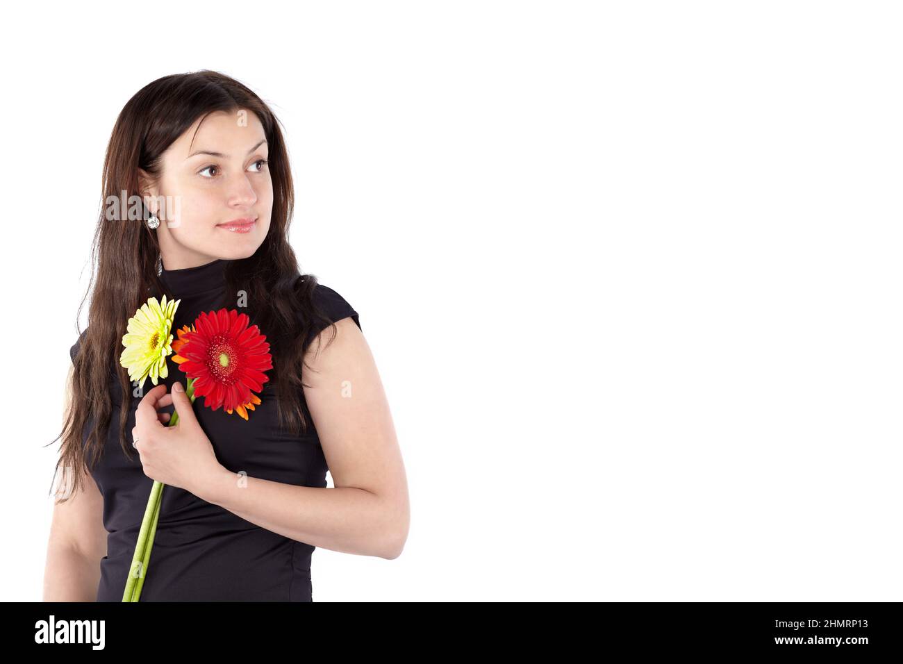 Beautiful young woman holding gerbera flowers isolated on white background with space for text and ads Stock Photo