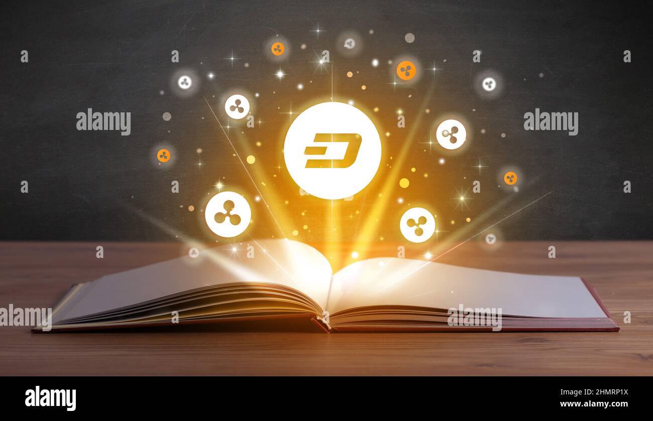 Open book with currency icons above Stock Photo - Alamy