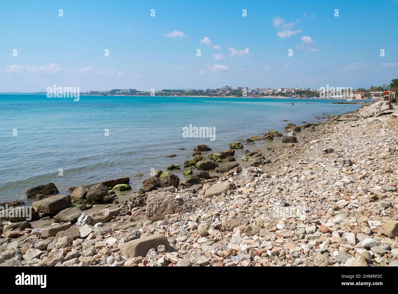 Sunny summer view of a coastline and beach near blue mediterranean sea. Beautiful world of mediterranean countries. Stock Photo