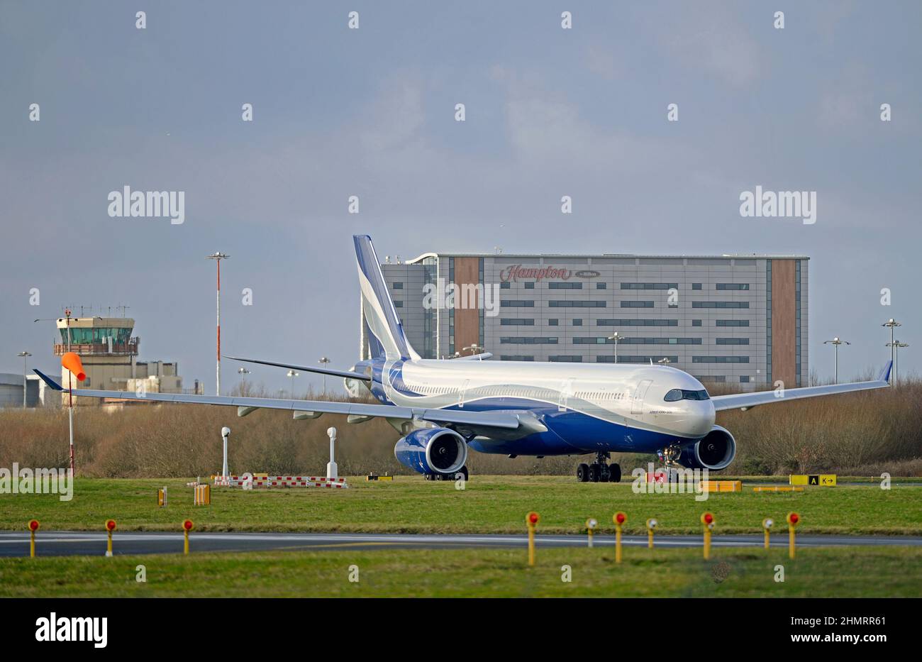 HIFLY MALTA AIRBUS A330-343, 9H-HFA, taxiing out to Liverpool John Lennon Airport's runway 27 for take off, Merseyside, England Stock Photo