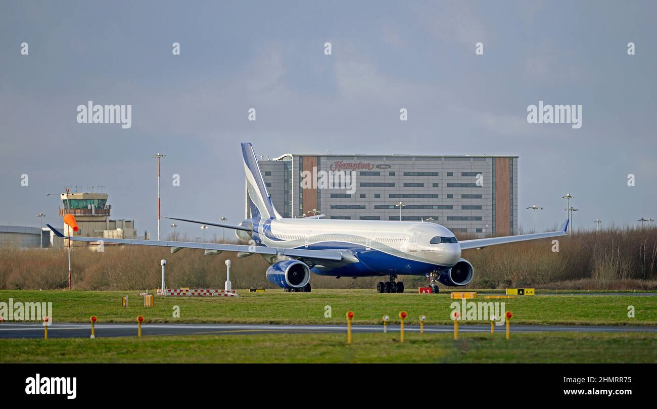 HIFLY MALTA AIRBUS A330-343, 9H-HFA, taxiing out to Liverpool John Lennon Airport's runway 27 for take off, Merseyside, England Stock Photo