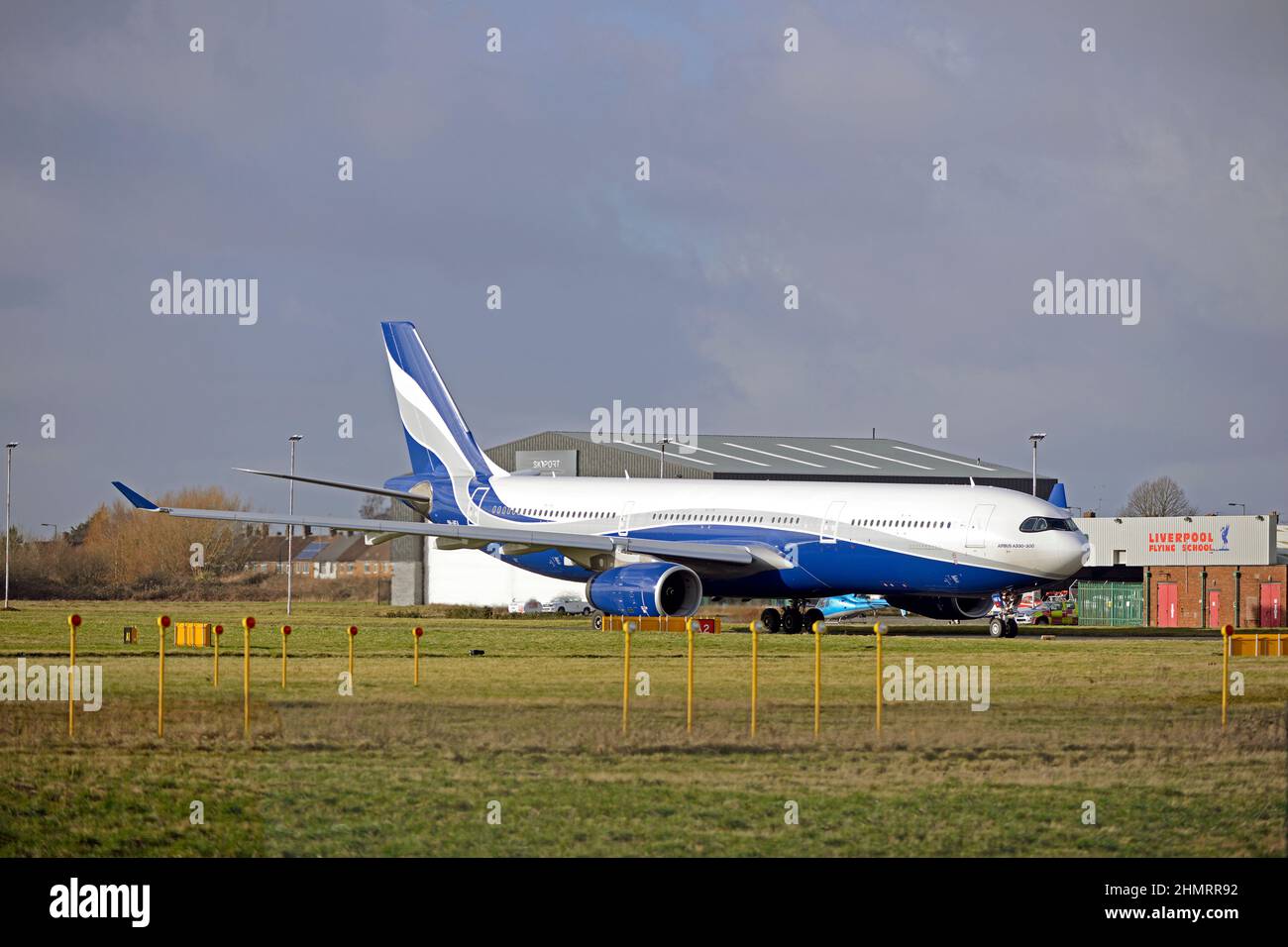 HIFLY MALTA AIRBUS A330-343, 9H-HFA, taxiing out to Liverpool John Lennon Airport's runway 27 for take off, Merseyside, England Stock Photo