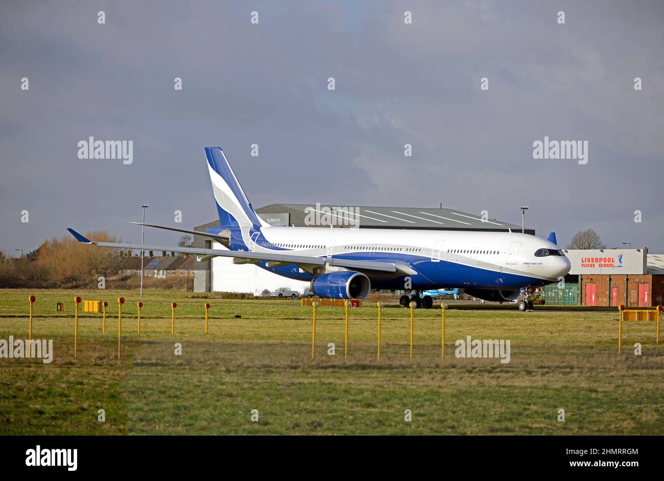 HIFLY MALTA AIRBUS A330-343, 9H-HFA, taxiing out to Liverpool John Lennon Airport's runway 27 for take off, Merseyside, England Stock Photo