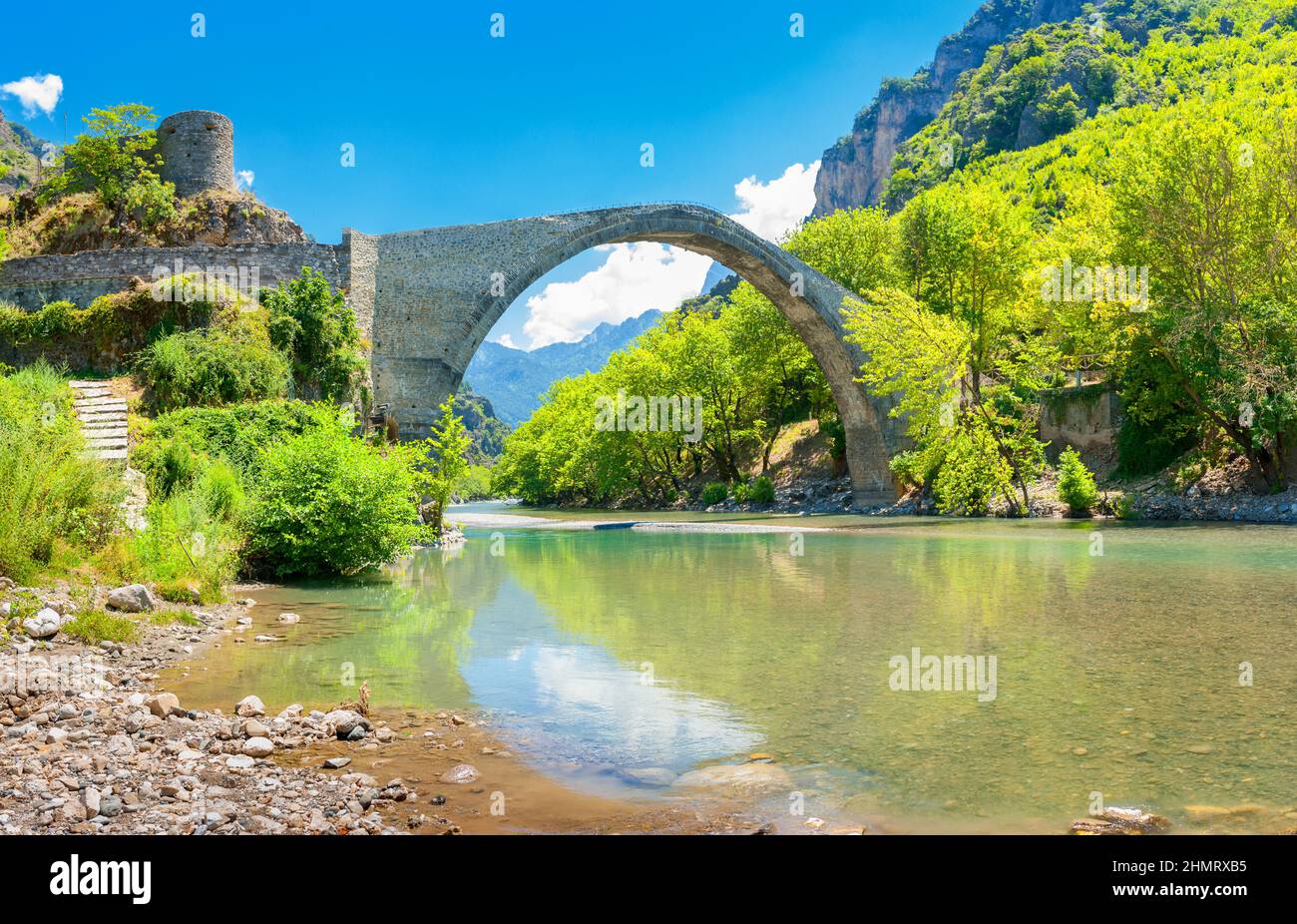 view of the old stoned bridge of Konitsa over the beautiful Aoos river, Zagori. Greece. Europe Stock Photo