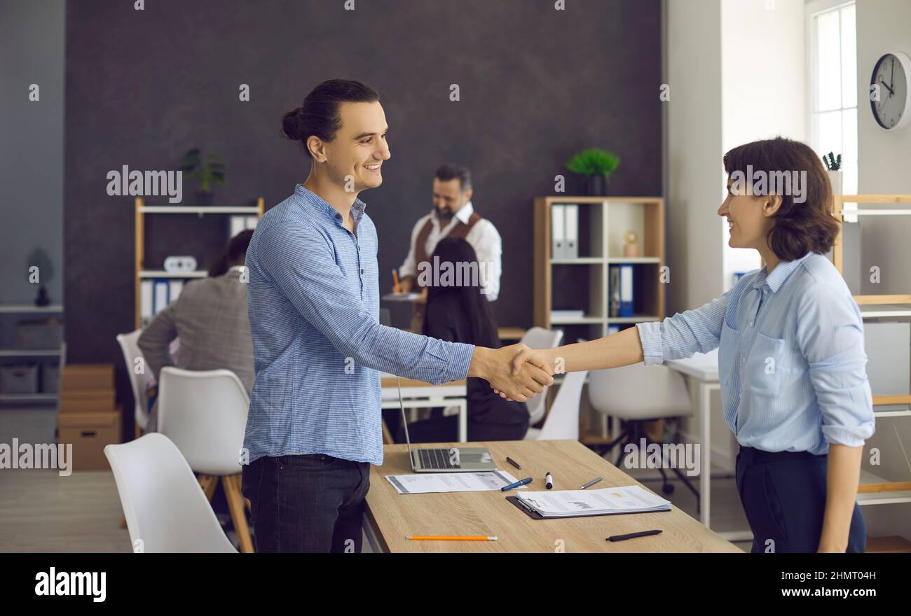 Man woman handshake office hi-res stock photography and images - Alamy