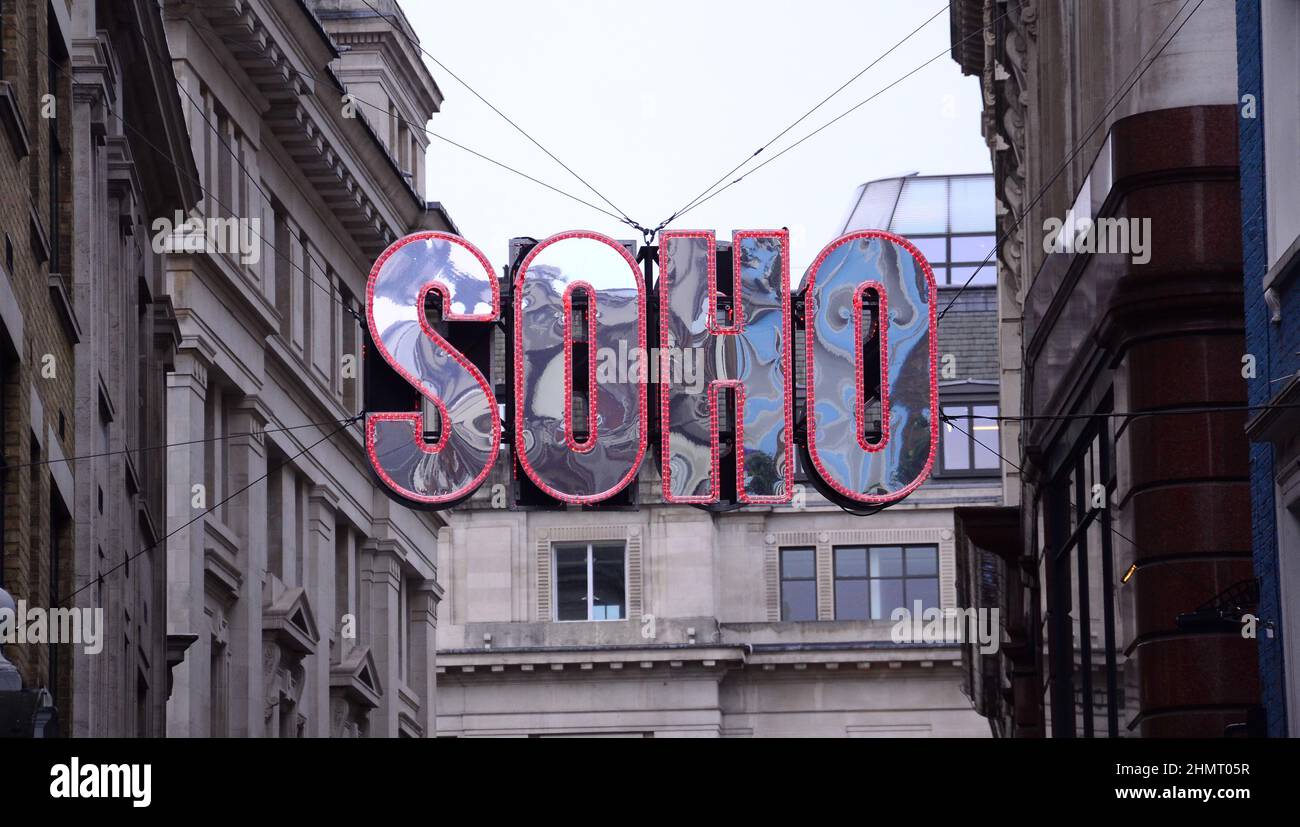 A 'Soho' sign or signage above Beak Street, Soho, London, United Kingdom, British Isles, welcome people to the area. Stock Photo