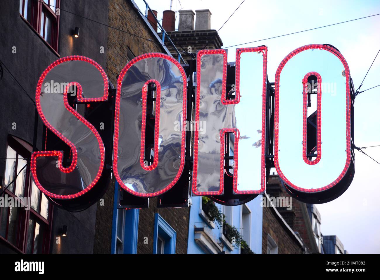 A 'Soho' sign or signage above Beak Street, Soho, London, UK, welcome people to the area. Stock Photo