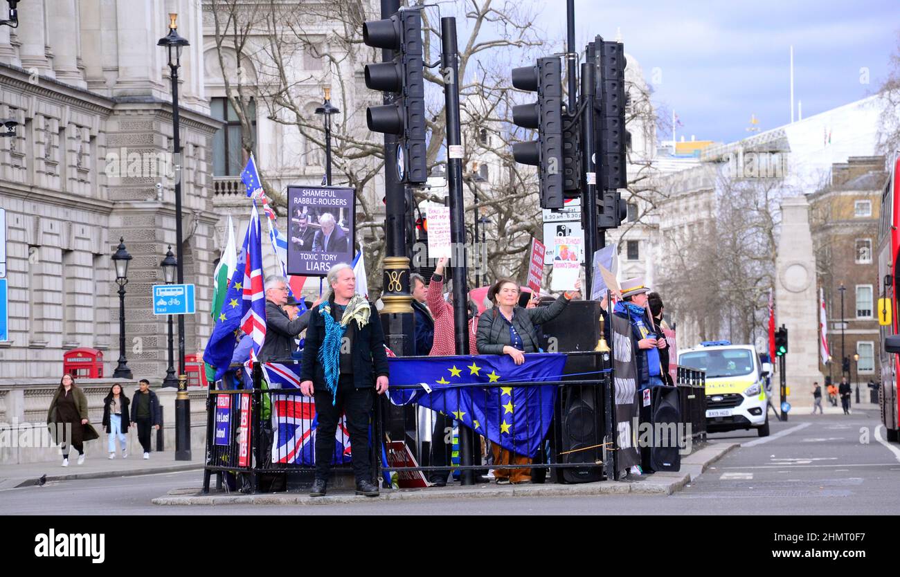 Anti brexit protesters hold placards during PMQ's across the road from the House of Commons, London, United Kingdom, British Isles. Stock Photo