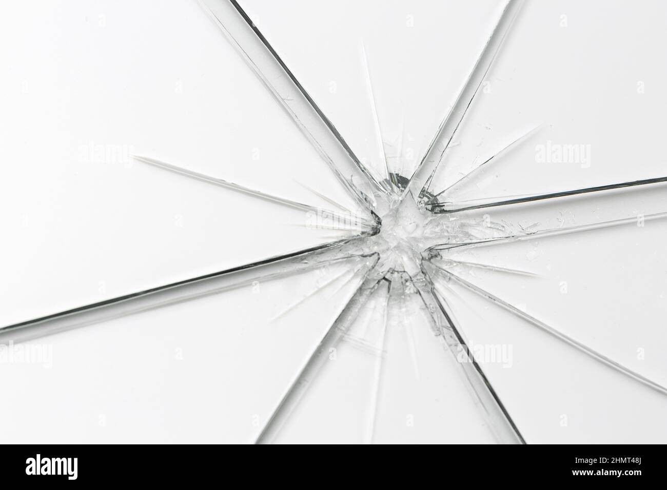Broken window glass crack splitter on white gray background Stock Photo