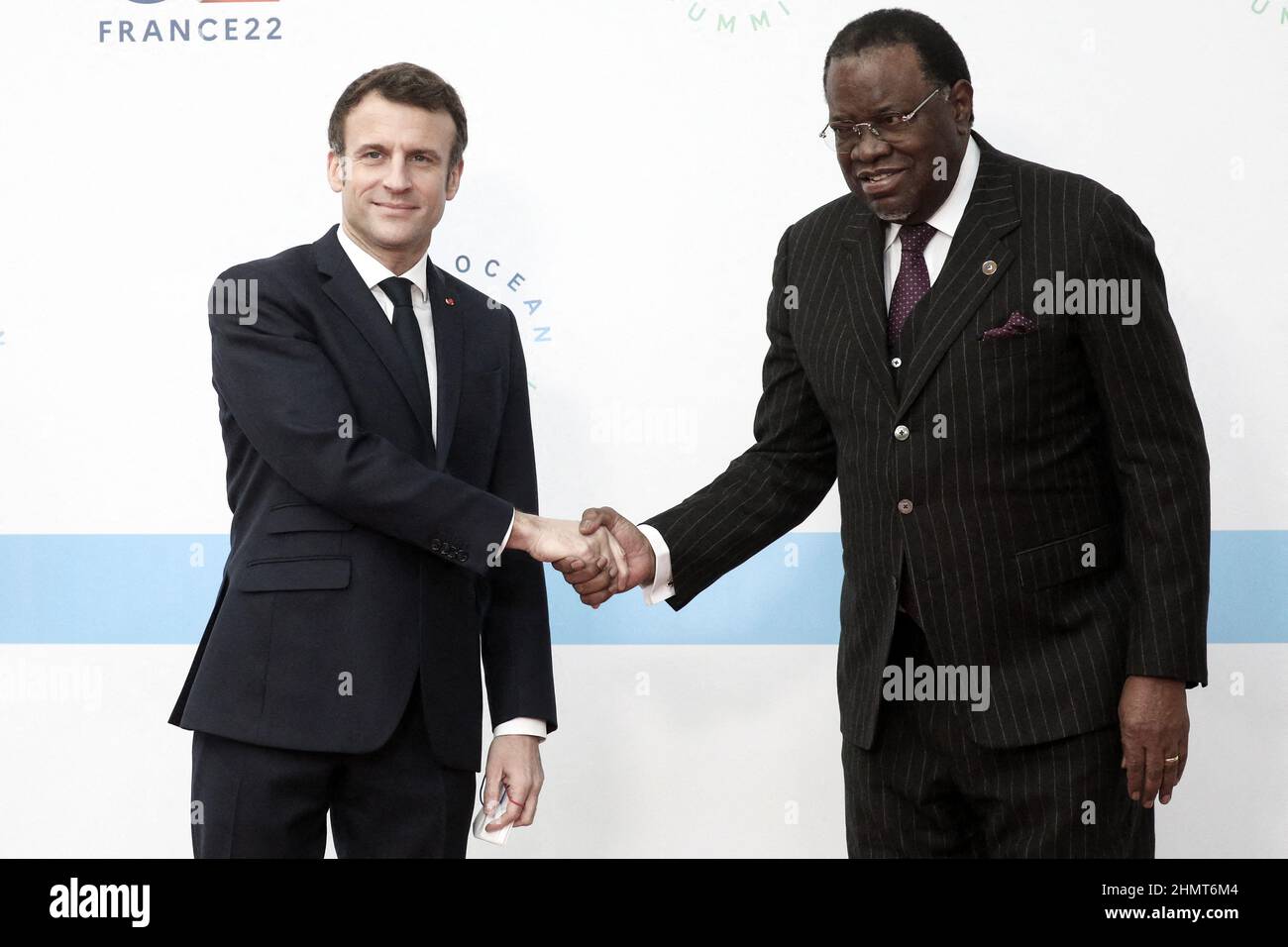 Brest, France. 11th Feb, 2022. Le président de la République française, Emmanuel Macron accueille le président namibien Hage Geingob lors du One Ocean Summit, qui vise à relever les ambitions de la communauté internationale pour protéger la vie marine, réduire la pollution plastique et lutter contre l'impact du changement climatique, dans la ville portuaire de Brest, France, le février 11, 2022. French President Emmanuel Macron during the One Ocean Summit, which seeks to raise the international community's ambitions to protect sealife, cut plastic pollution and tackle the impact of climate cha Stock Photo