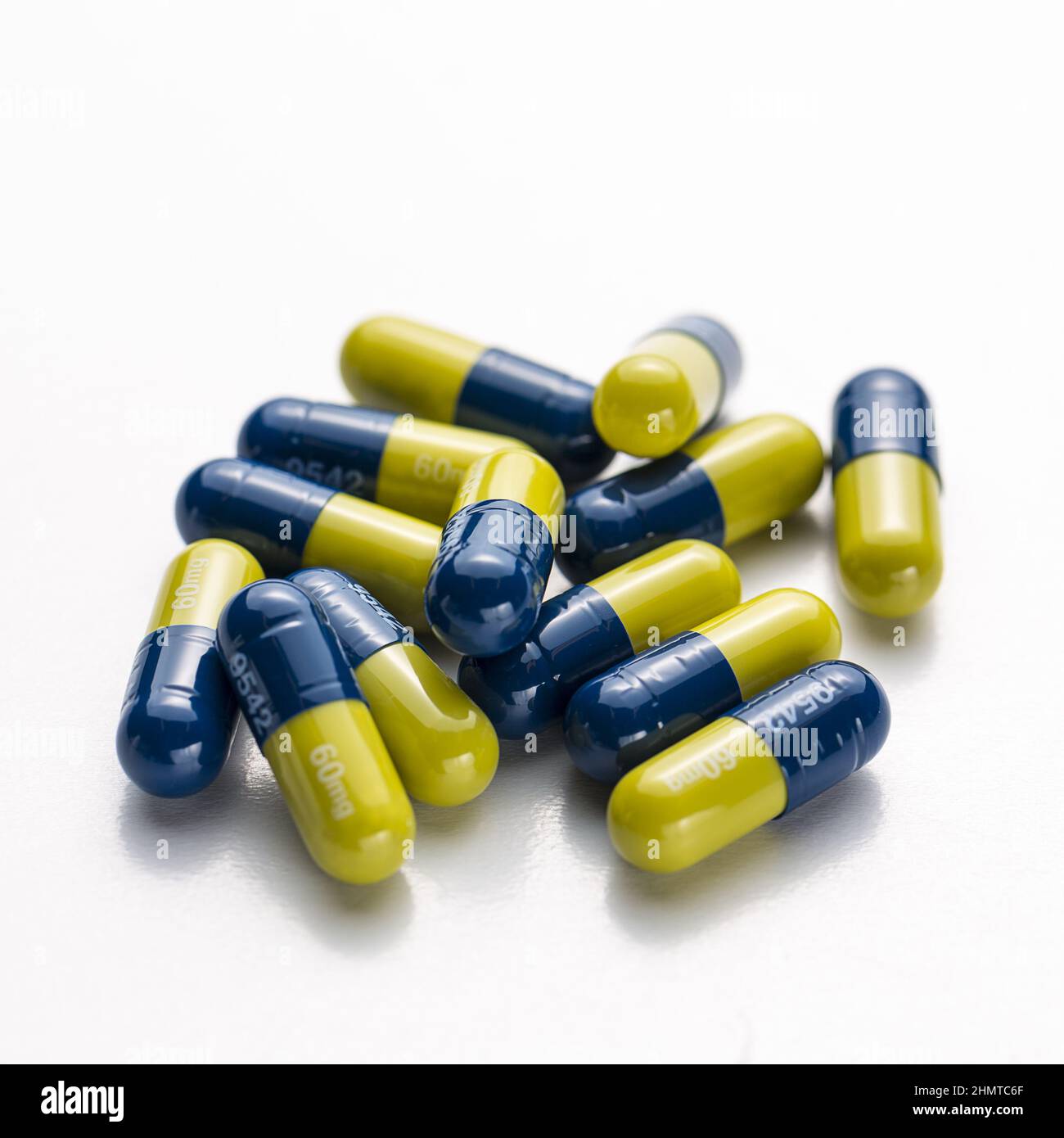 Blue yellow heap capsules therapy pills flu doctor antibiotic pharmacy medicine medical Stock Photo