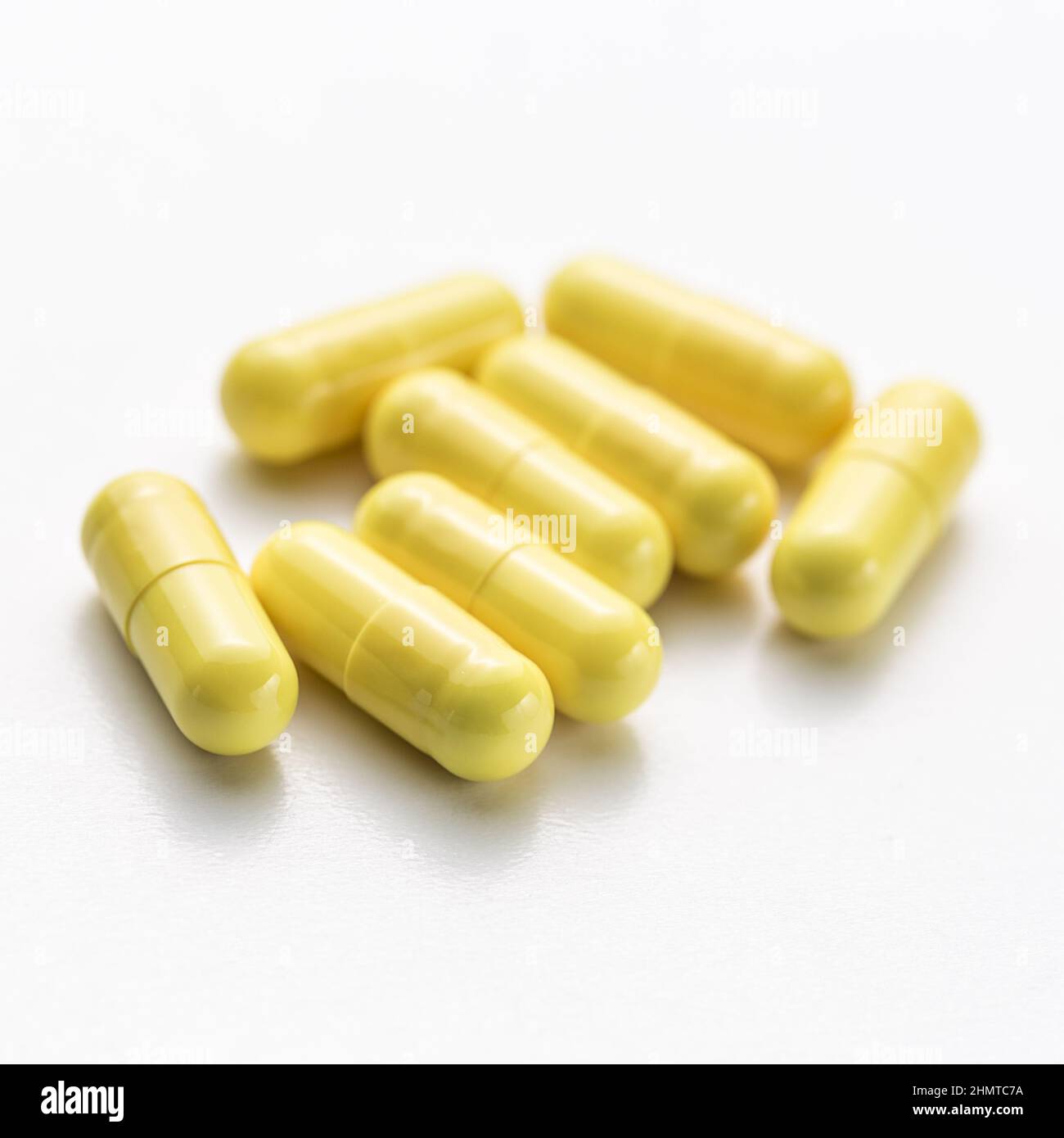 Yellow capsule drugs therapy doctor flu antibiotic pharmacy medicine medical Stock Photo