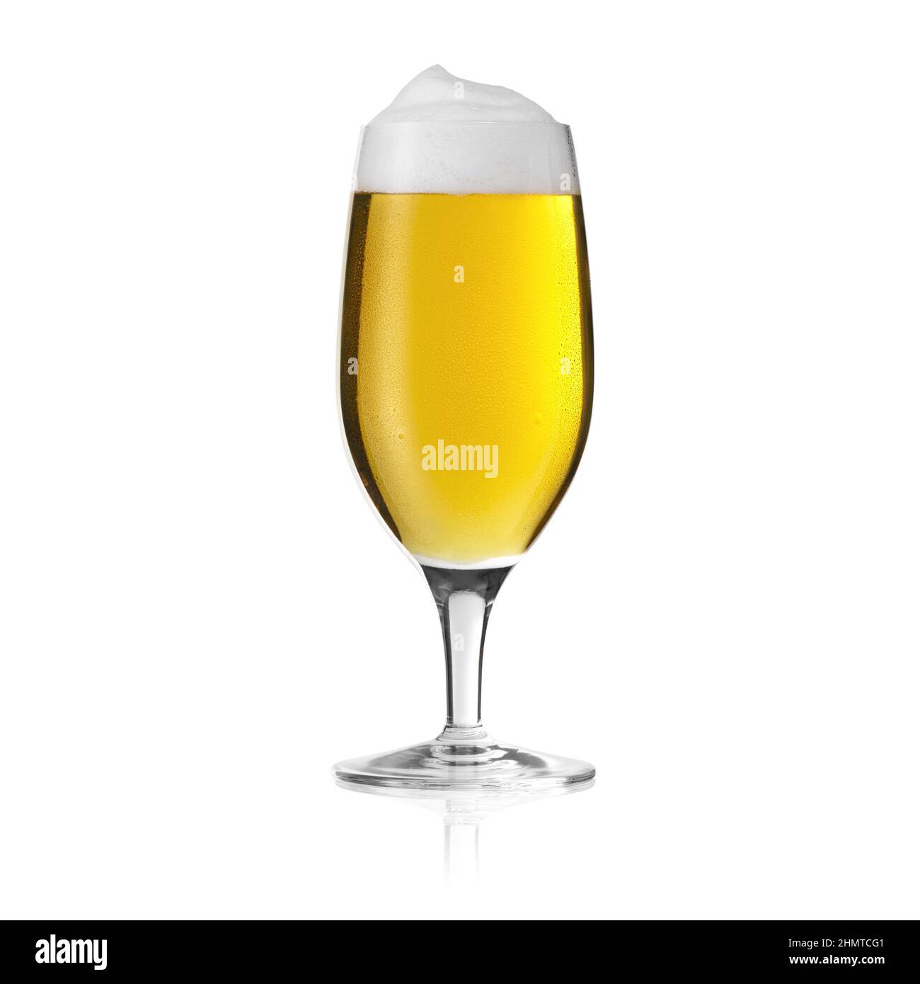 Altbier Pilsner beer glass with foam crown with golden drops of dew condensation drops fresh alcohol on a white background Stock Photo