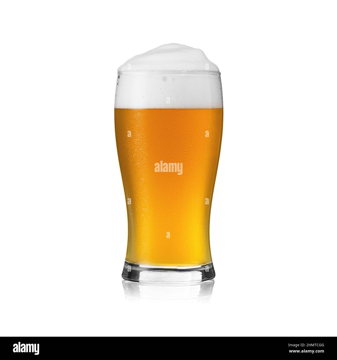 Beer glass with beer foam crown and fresh waterdrop dew golden party