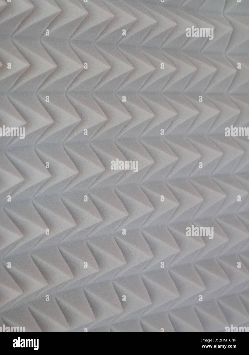 Grey acoustic foam rubber. Soundproof pyramids, full frame. Stock Photo
