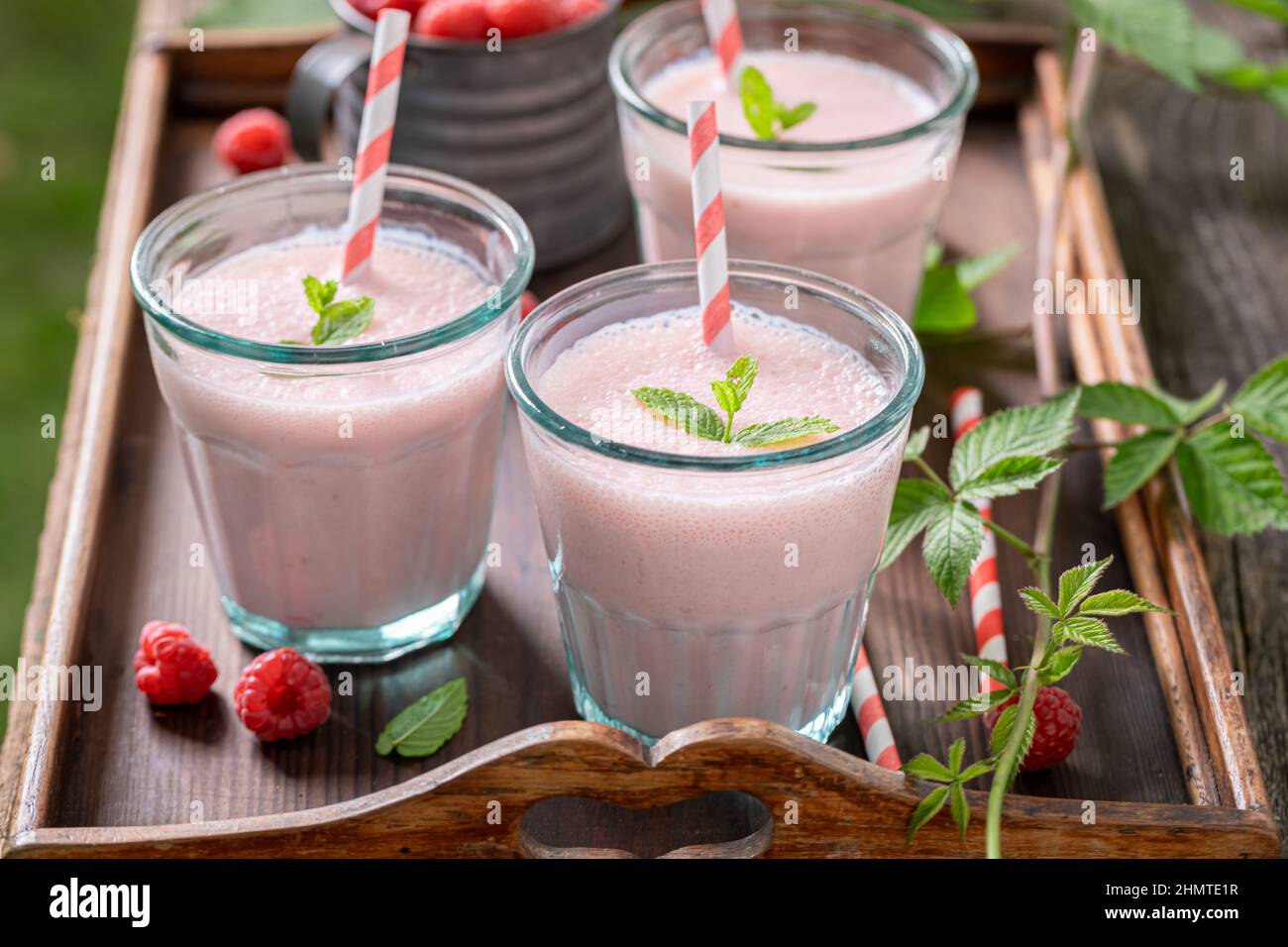 Homemade cocktail with seasonal fruit and milk. Fresh raspberry