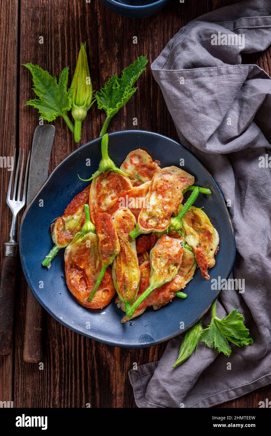 Healthy fried zucchini flower as unique summer vegetarian snack. Squash