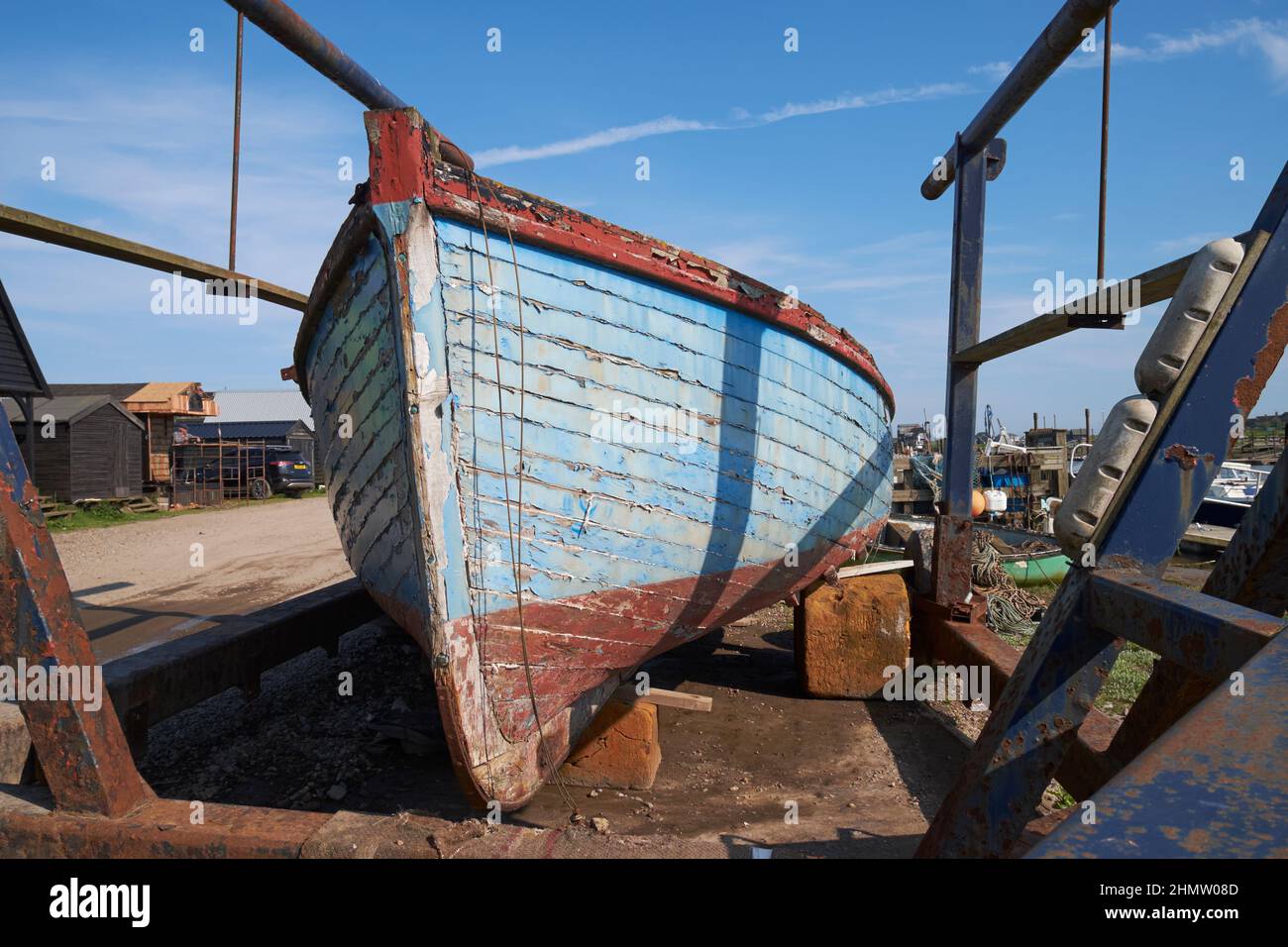 An old boat awaiting restoration at Southwold harbour, Suffolk, UK. Stock Photo