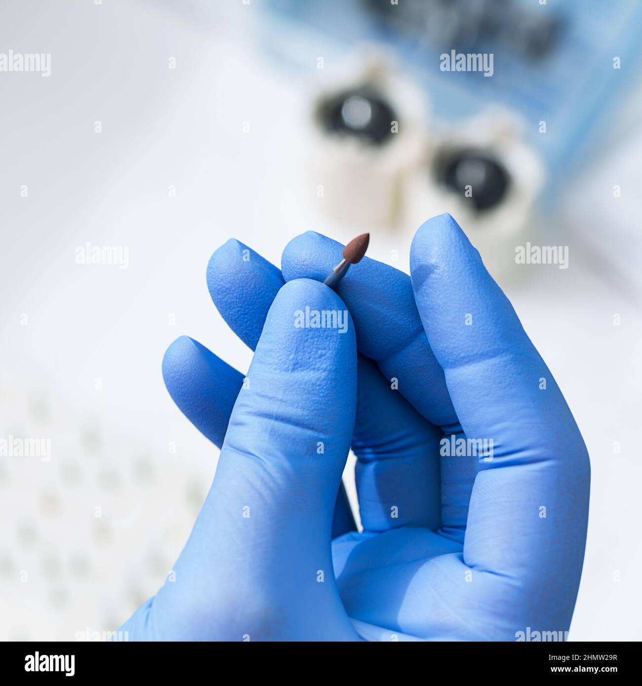 female dentist hand holding drill Stock Photo Alamy