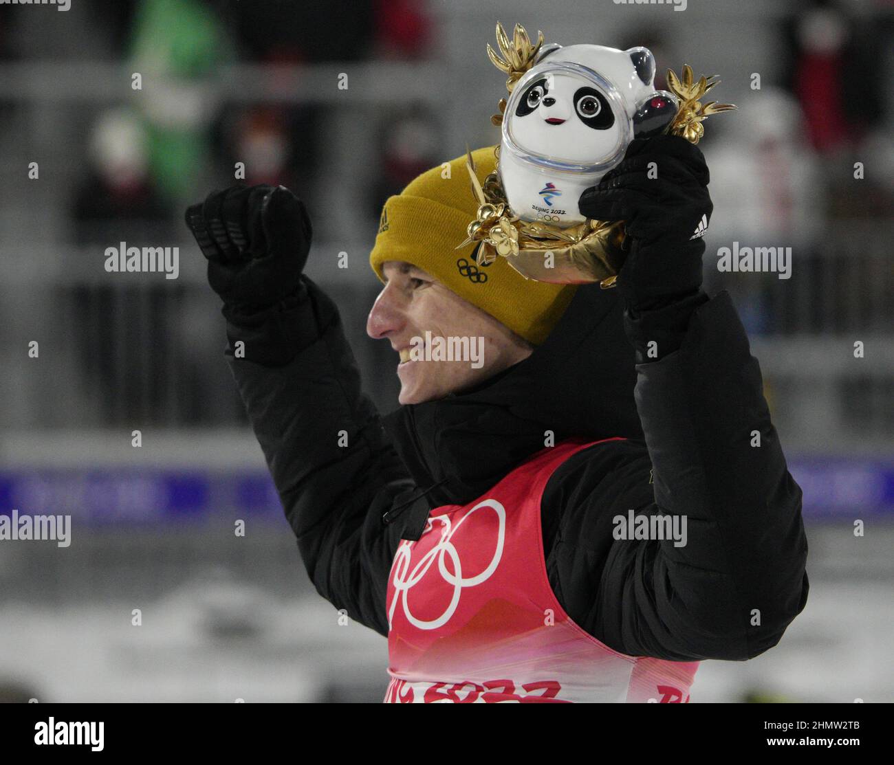 Zhangjiakou, China. 12th Feb, 2022. Bronze medalist Karl Geiger of Germany waves after the Men's Ski Jumping Individual Large Hill finals at the 2022 Winter Olympics in Zhangjiakou, China on Saturday, February 12, 2022. Norway's Marius Lindvik won the gold medal and Japan's Ryoyu Kobayashi won the silver medal. Photo by Bob Strong/UPI Credit: UPI/Alamy Live News Stock Photo