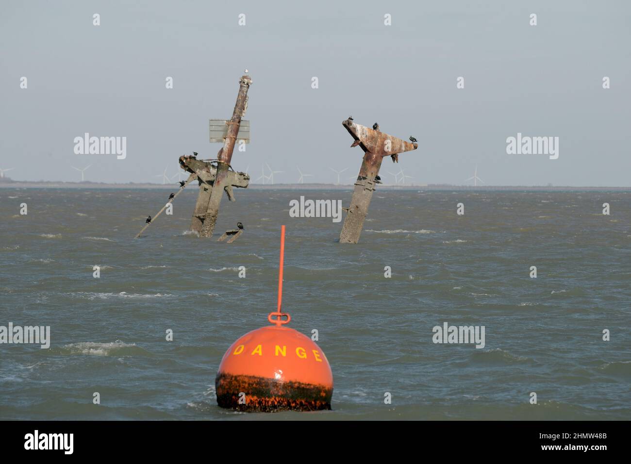 Sheerness, Kent, UK. 12th Feb, 2022. The wreck of the SS Richard Montgomery that sunk in August 1944 in the Thames Estuary off Sheerness Kent. The ship ran aground during WW2 and still contains 1,400 tonnes of explosives and now 78 years after the sinking Royal Naval bomb disposal experts have been called in to make the wreck safe by initially removing the ships masts that have remained visible within the exclusion zone placed around the vessel. Credit: MARTIN DALTON/Alamy Live News Stock Photo