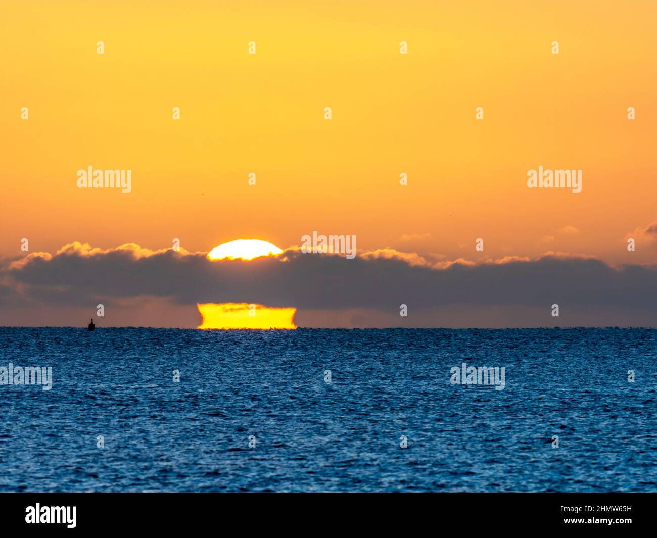 The sun rising at dawn over the North Sea from Beadnell, Northumberland ...