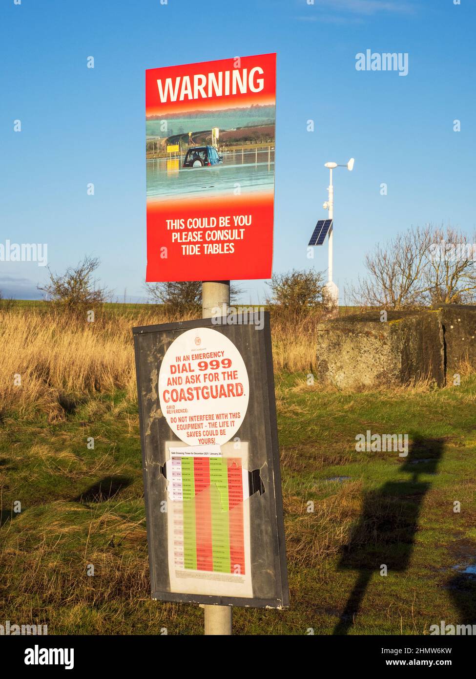 A warning sign for cars crossing the causeway to Holy Island, Northumberland, UK. Stock Photo