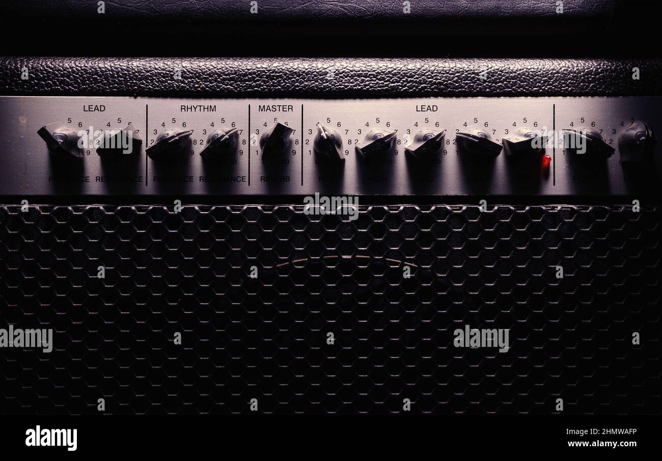 Details of classical guitar amp, view on potentiometers and cabin. Stock Photo