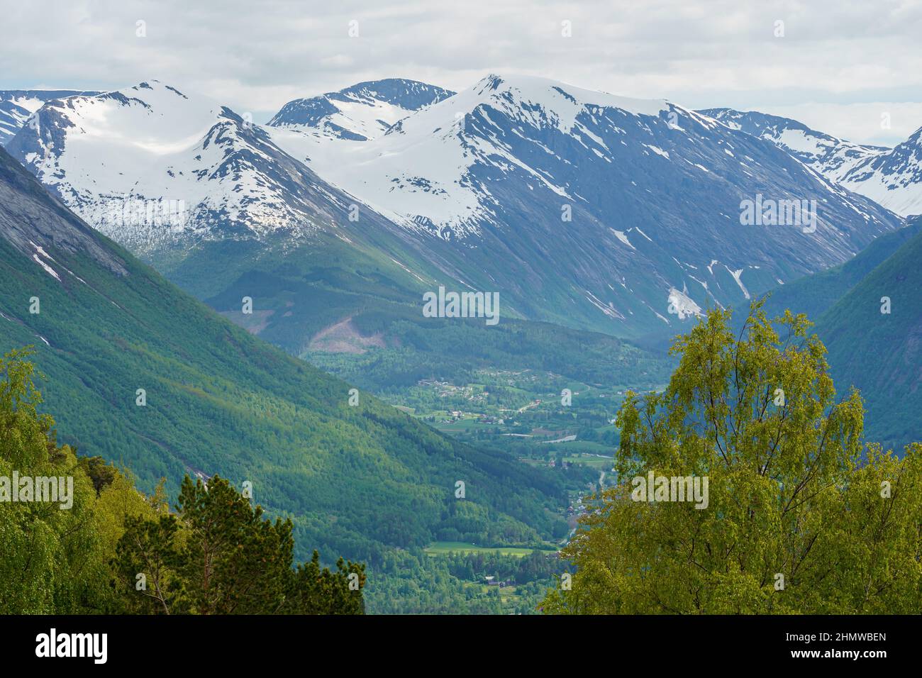 VALLDAL, NORWAY - 2020 JUNE 09. Arial view over Valldal and Tafjord with mountains with snow. Stock Photo