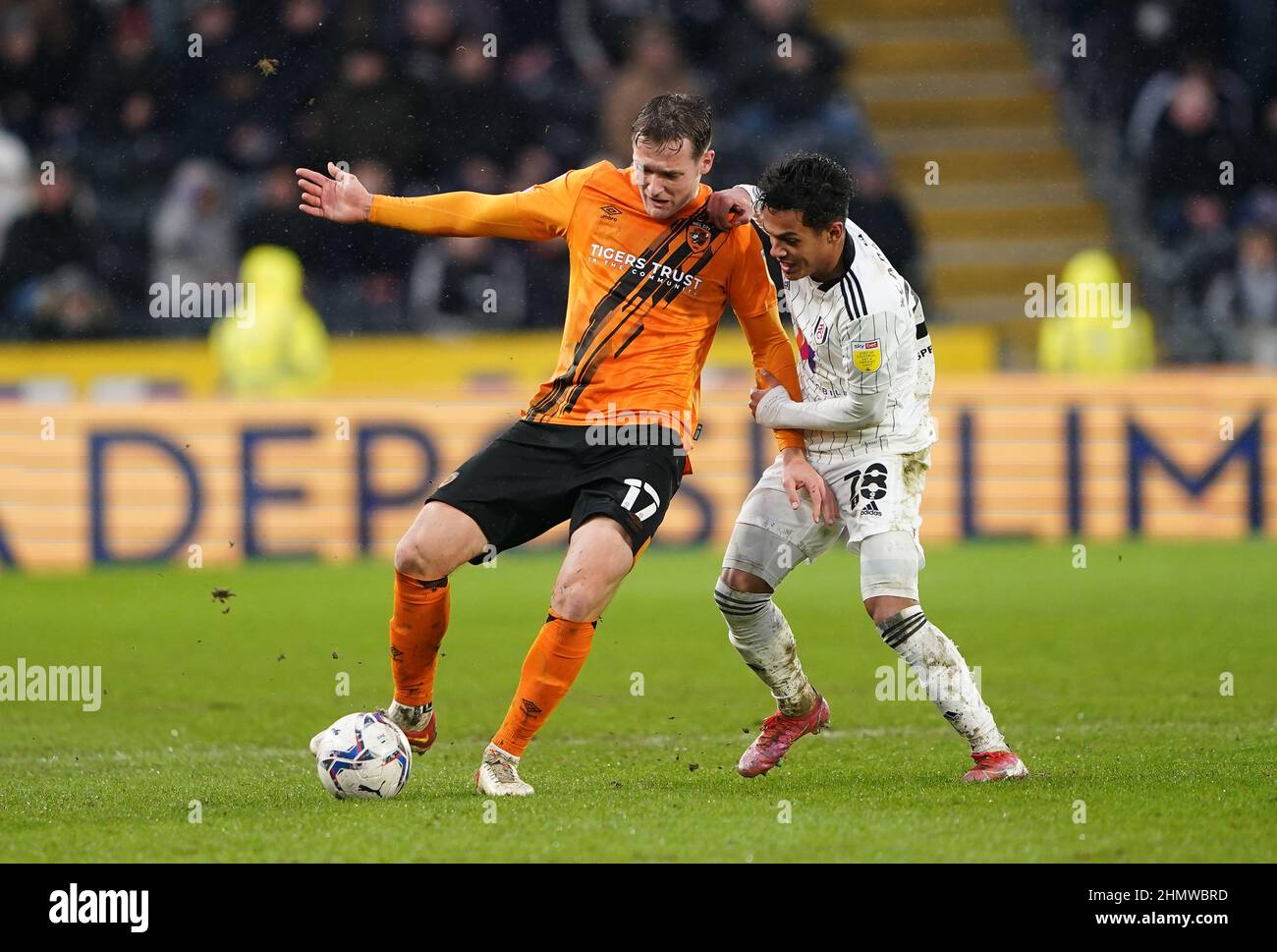 Hull City's Sean McLoughlin (left) and Fulham's Fabio Carvalho battle for the ball during the Sky Bet Championship match at the MKM Stadium, Hull. Picture date: Saturday February 12, 2022. Stock Photo