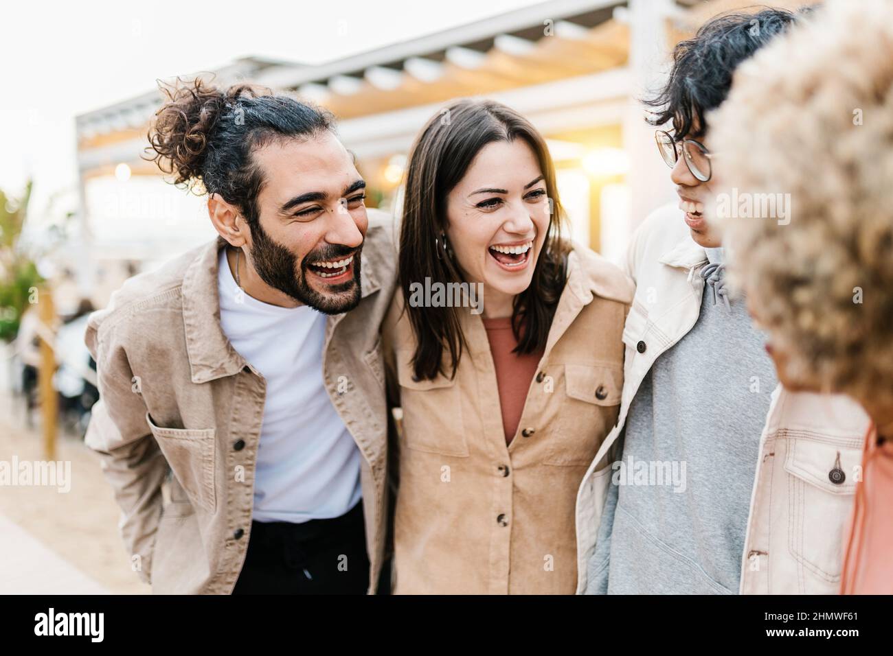 Group of young diverse friends having fun on party at beach Stock Photo