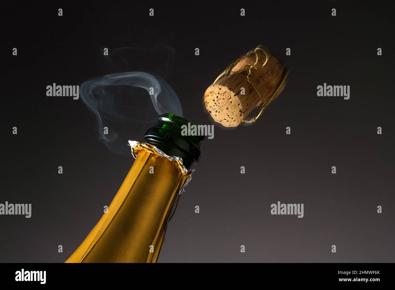 Cork popping out champagne bottle hires stock photography and images