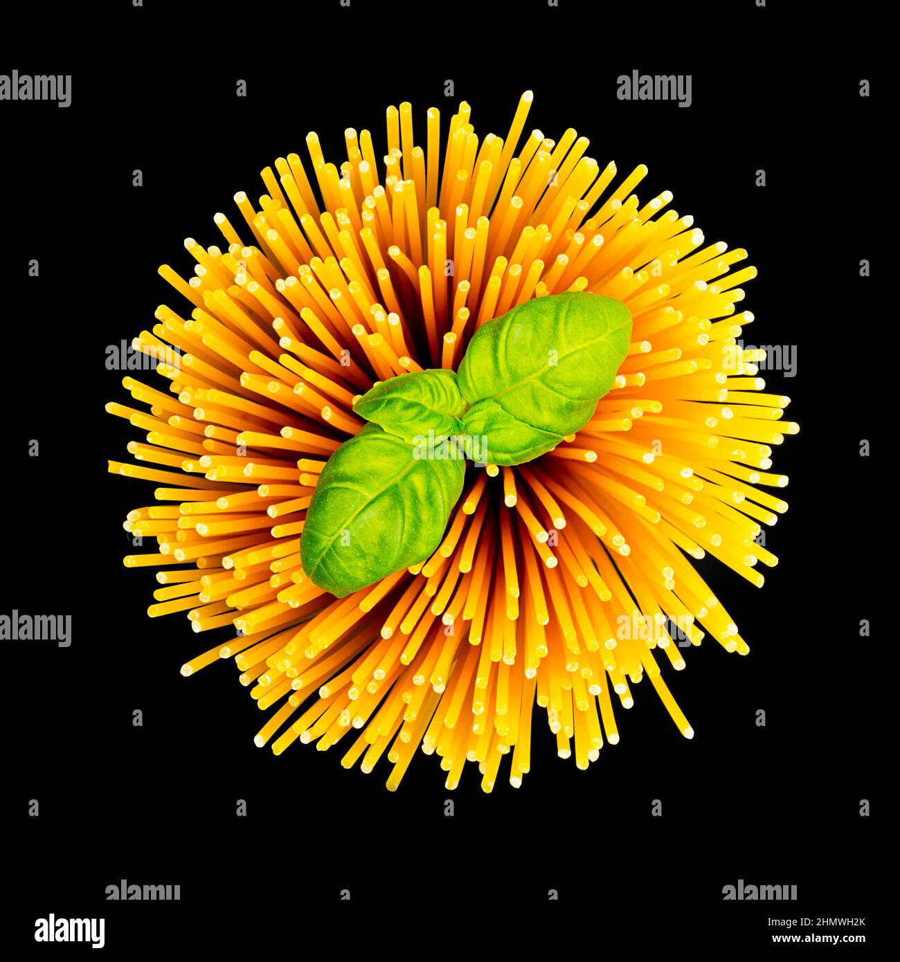 spaghetti twister with basil on black Stock Photo Alamy