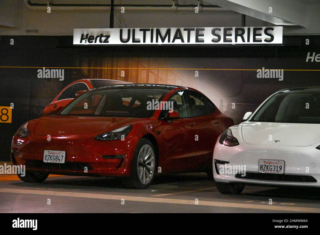 Tesla Model 3 cars sit on in a Hertz rental car parking garage on Tuesday, Feb 08, 2022 in San Francisco. (Dylan Stewart/Image of Sport) Stock Photo