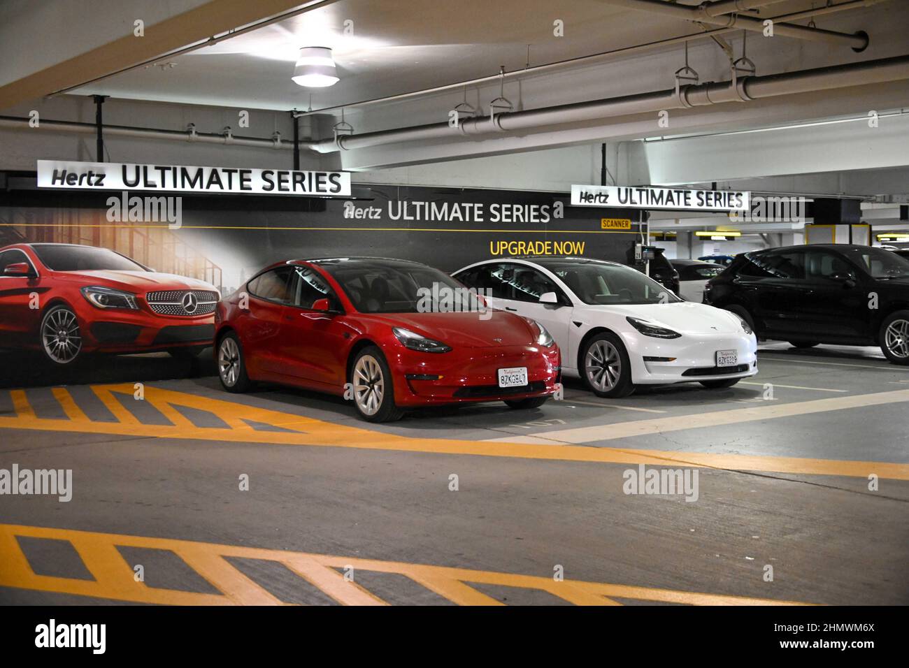 Tesla Model 3 cars sit on in a Hertz rental car parking garage on Tuesday, Feb 08, 2022 in San Francisco. (Dylan Stewart/Image of Sport) Stock Photo