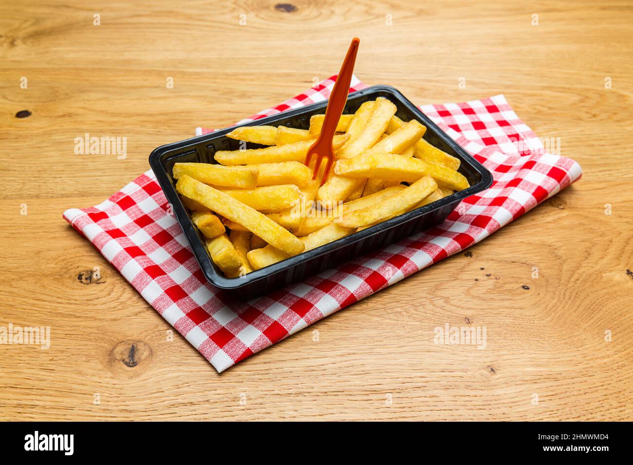 Fries Shell Belgian fries in a black shell with fork Stock Photo - Alamy
