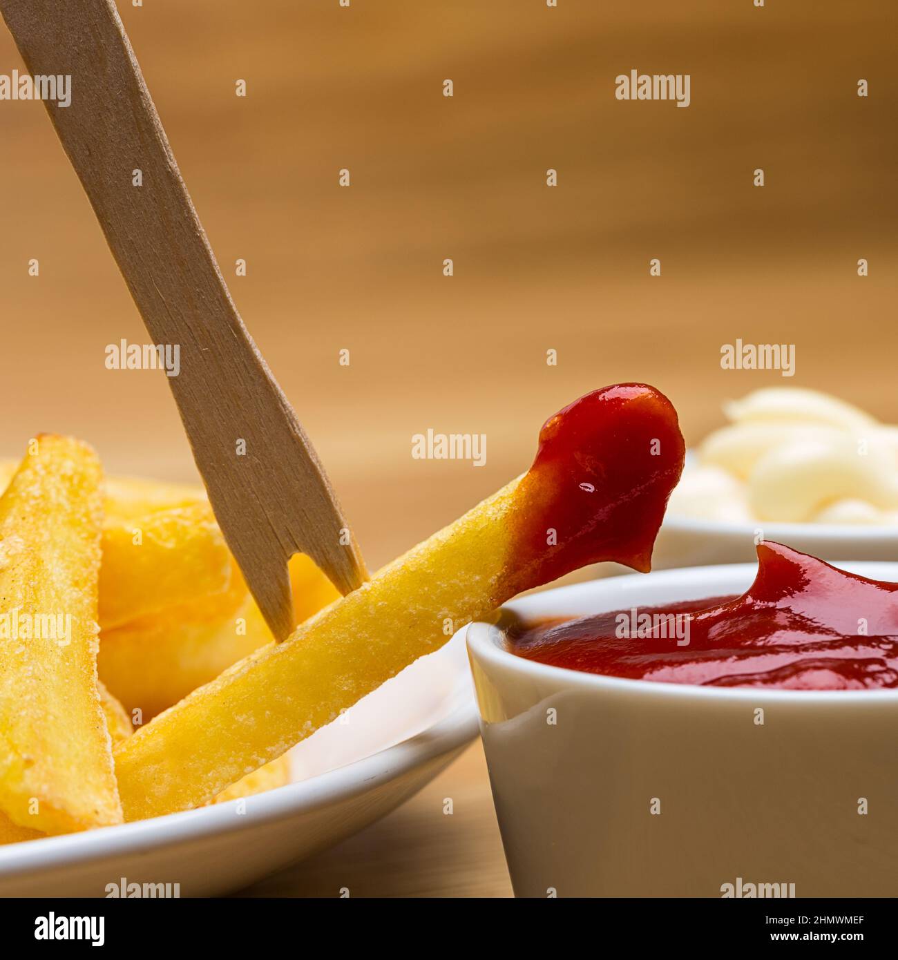 French fries with sauces and fork Stock Photo Alamy