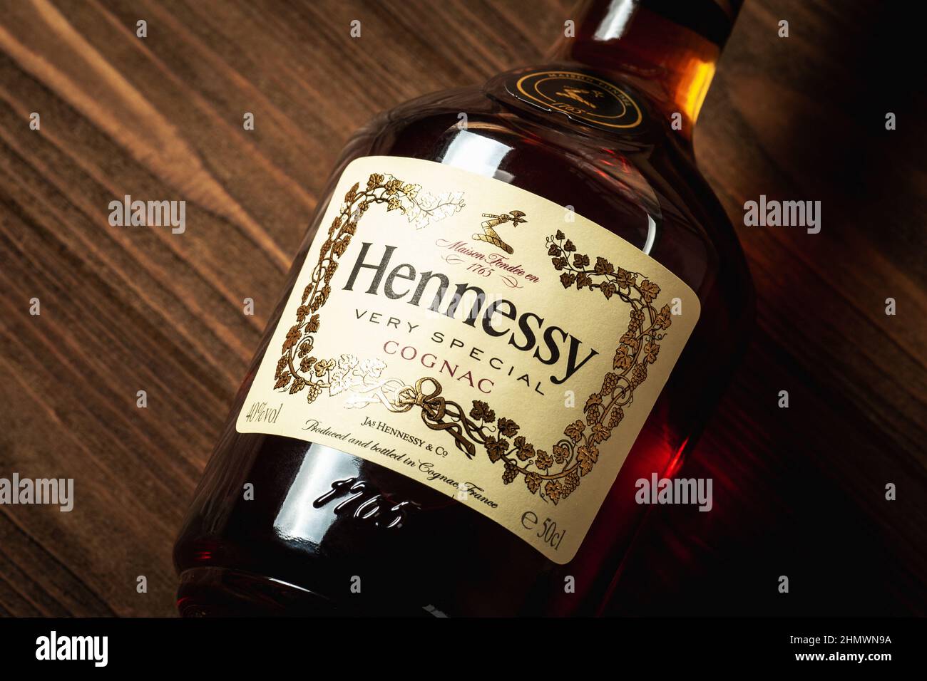 Ternopil, Ukraine - April 29, 2021: A bottle of Hennessy very special cognac on a wooden table. Close up cognac bottle Stock Photo