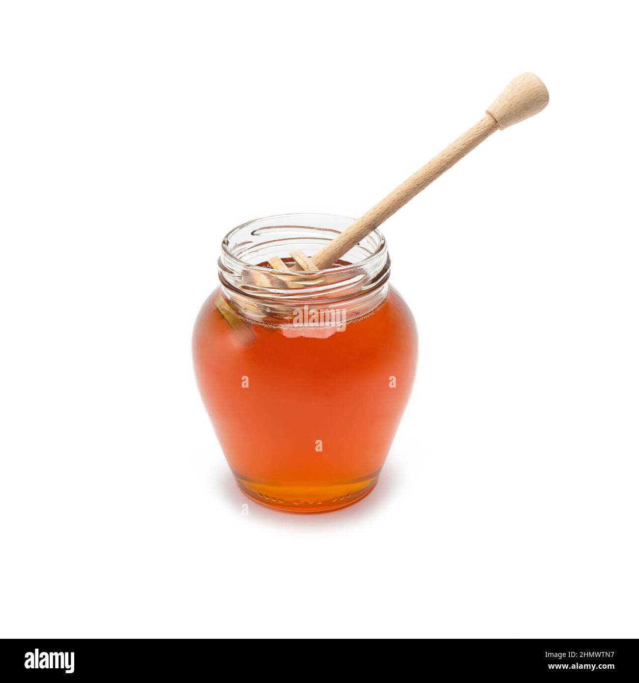 glass jar with honey dipper Stock Photo Alamy