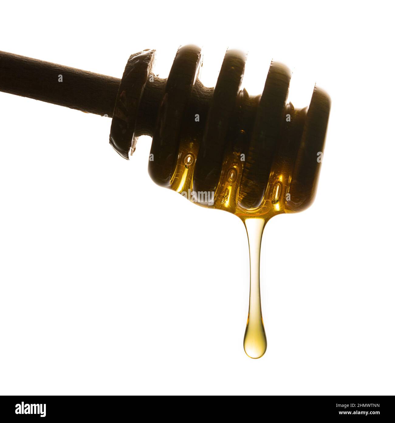 honey dipper with dropping honey Stock Photo Alamy