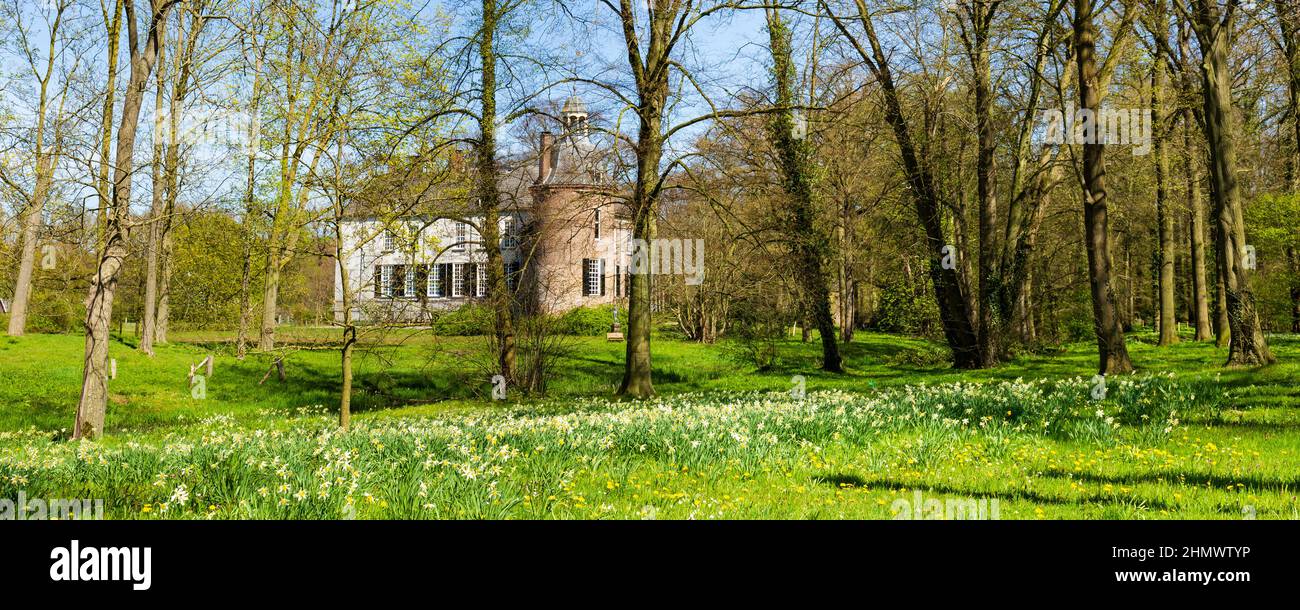 Vorden, The Netherlands - April 26, 2021: Castle and park Hackfort in Vorden Gelderland in The Netherlands famous for his beautiful wild flowers Stock Photo