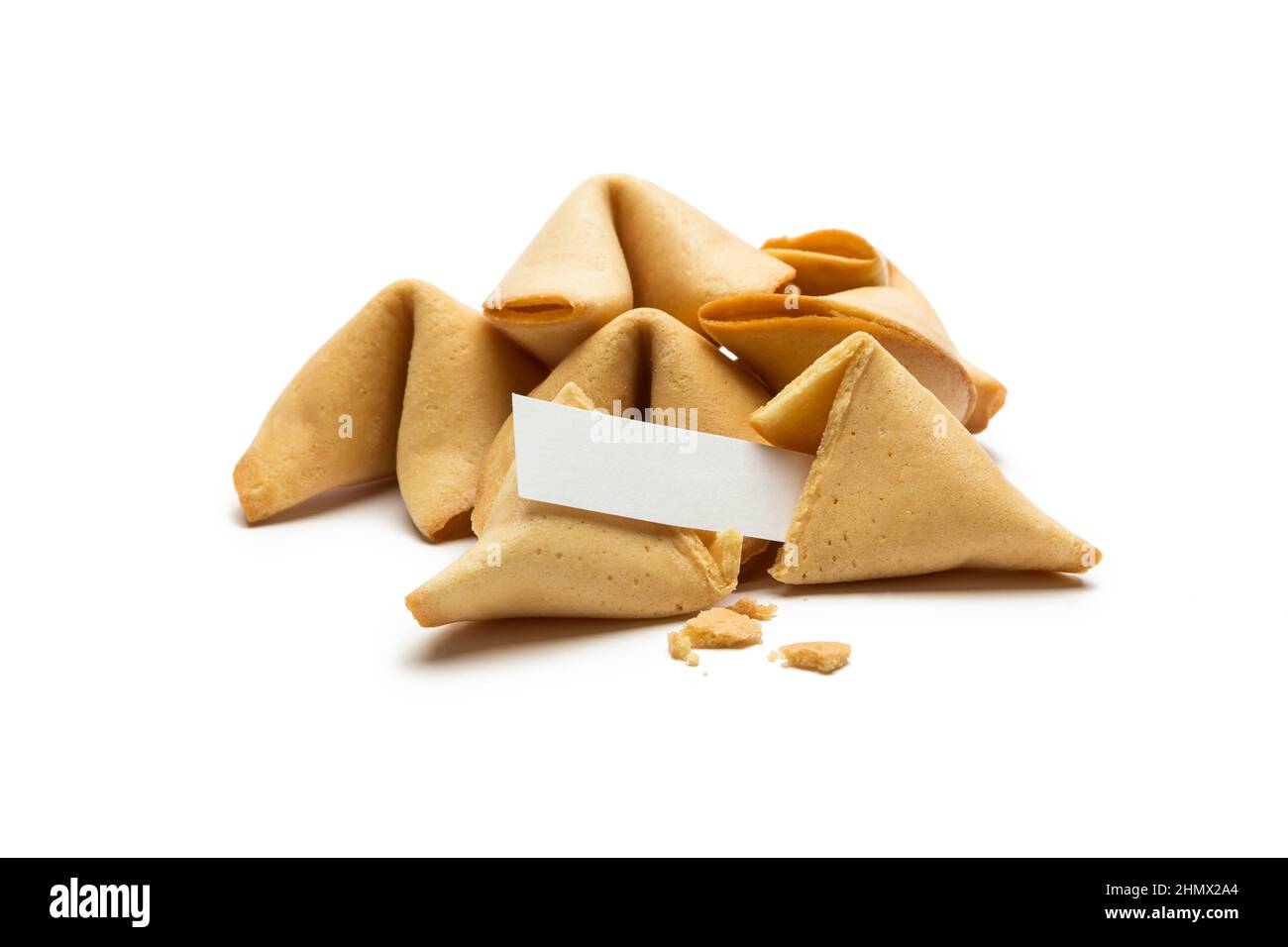 A pile of asian fortune cookie with note isolated on white background